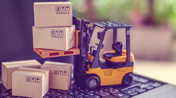 Toy forklift moving cardboard boxes