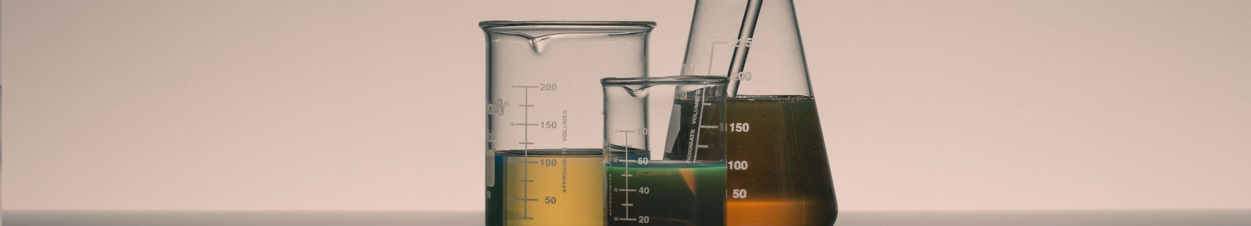 Collection of three beakers with chemicals